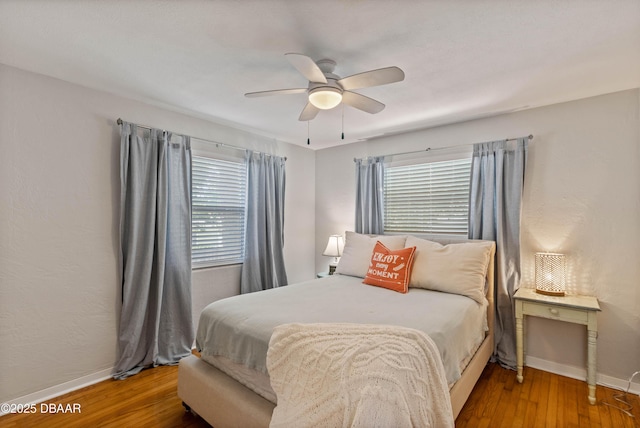 326 Flushing Ave, Daytona Beach, FL 32118 - bedroom with baseboards, wood finished floors, and a ceiling fan