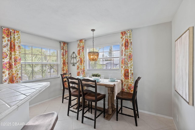 326 Flushing Ave, Daytona Beach, FL 32118 - dining space with baseboards and light tile patterned floors