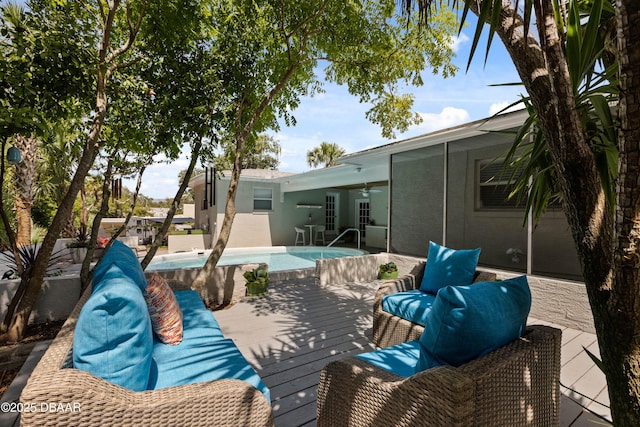 326 Flushing Ave, Daytona Beach, FL 32118 - view of patio with a ceiling fan, a deck, and an outdoor pool