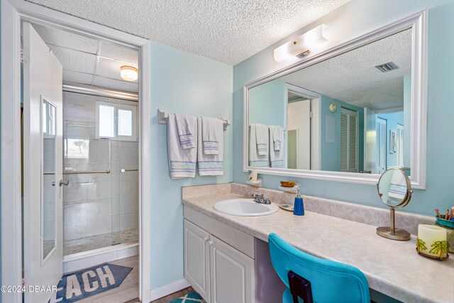 bathroom with hardwood / wood-style flooring, a shower with door, and vanity