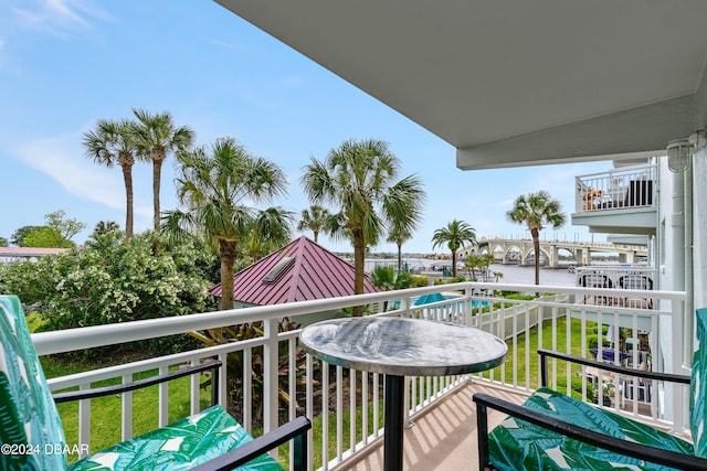 balcony featuring a water view