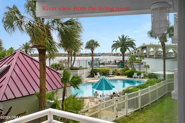 view of pool with a water view