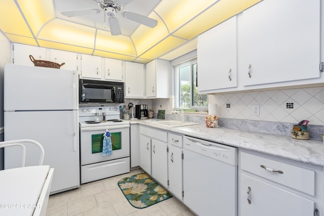 kitchen with white cabinetry, sink, white appliances, and backsplash