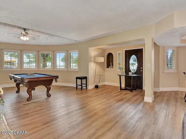 game room with pool table, plenty of natural light, and hardwood / wood-style floors