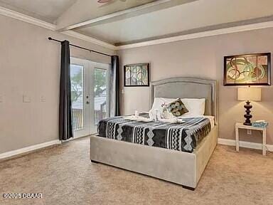 carpeted bedroom with ornamental molding and access to outside