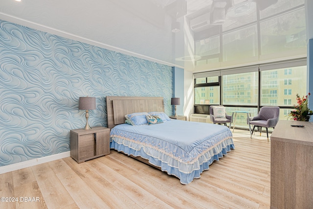 bedroom with hardwood / wood-style flooring