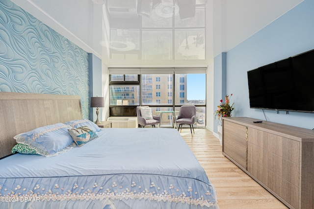 bedroom with light wood-type flooring