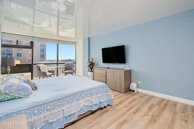 bedroom with light hardwood / wood-style flooring