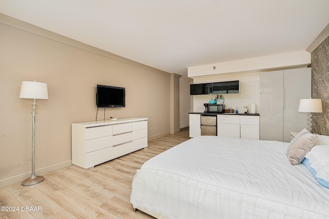 bedroom with light hardwood / wood-style floors