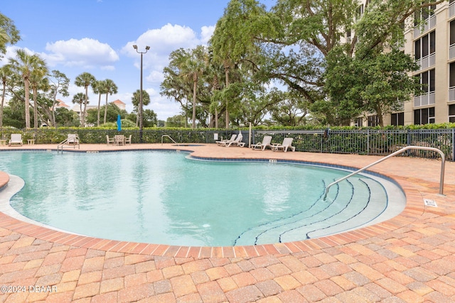146 Palm Coast Resort Blvd Unit 409, Palm Coast, FL 32137 - community pool featuring a patio area