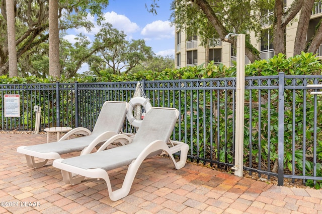 view of patio featuring a balcony