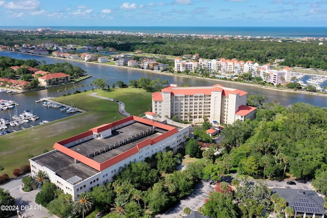 birds eye view of property featuring a water view