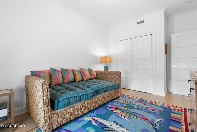 146 Palm Coast Resort Blvd Unit 409, Palm Coast, FL 32137 - living room featuring ornamental molding, wood finished floors, and baseboards