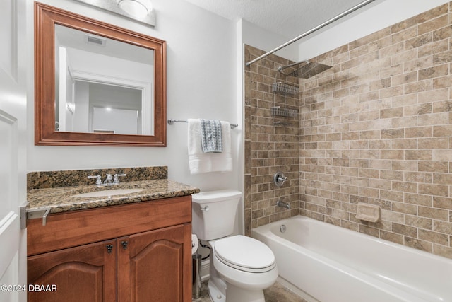 full bathroom featuring vanity, a textured ceiling, toilet, and tiled shower / bath