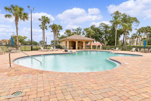 146 Palm Coast Resort Blvd Unit 409, Palm Coast, FL 32137 - community pool featuring a patio area