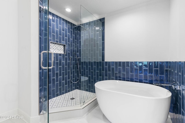 146 Palm Coast Resort Blvd Unit 409, Palm Coast, FL 32137 - full bathroom with tile walls, a soaking tub, a stall shower, ornamental molding, and recessed lighting