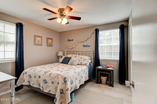 bedroom featuring ceiling fan and light tile patterned floors