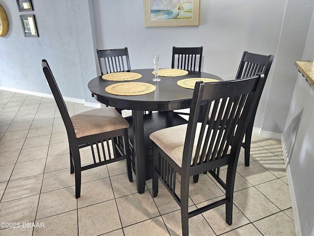 dining room featuring light tile patterned floors