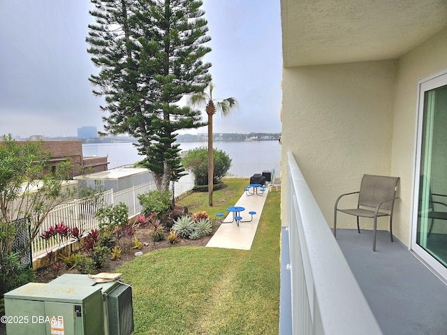 balcony featuring a water view