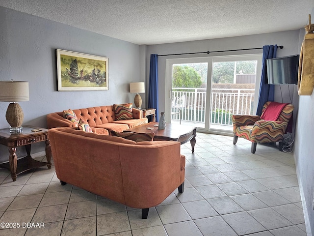 tiled living room featuring a textured ceiling