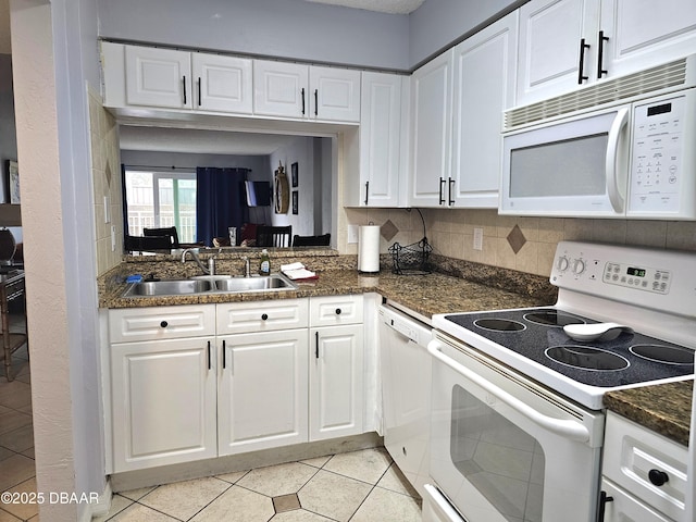 kitchen featuring white cabinetry, sink, and white appliances