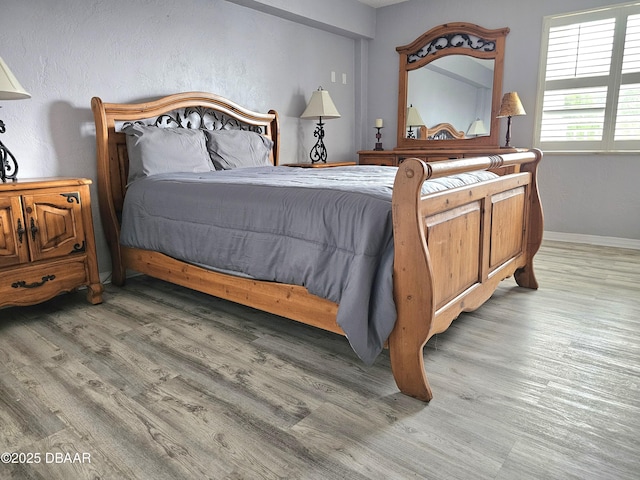 bedroom featuring wood-type flooring