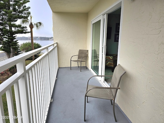 balcony featuring a water view