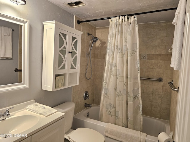 full bathroom with vanity, toilet, and shower / bath combo