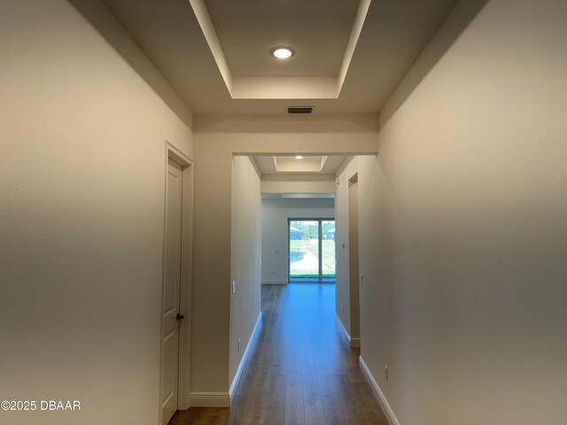 2009 Divot Dr, Daytona Beach, FL 32124 - corridor with a tray ceiling, dark wood-style floors, baseboards, and visible vents