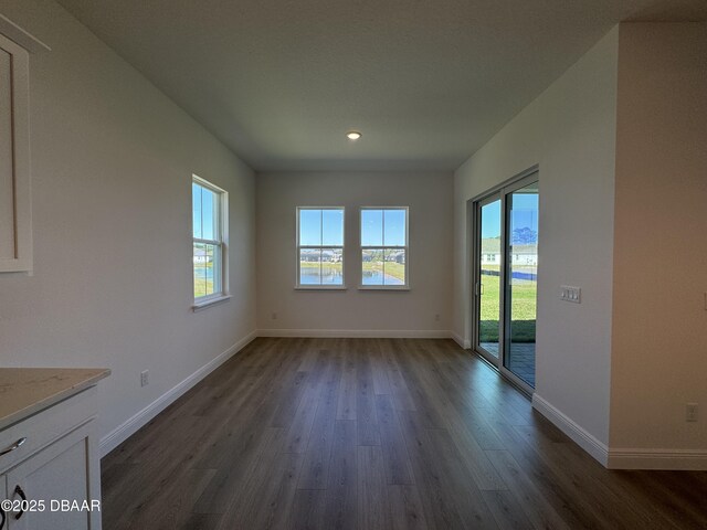 2009 Divot Dr, Daytona Beach, FL 32124 - interior space featuring dark wood finished floors and baseboards