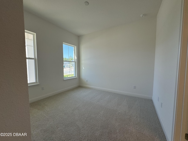 2009 Divot Dr, Daytona Beach, FL 32124 - carpeted spare room featuring baseboards