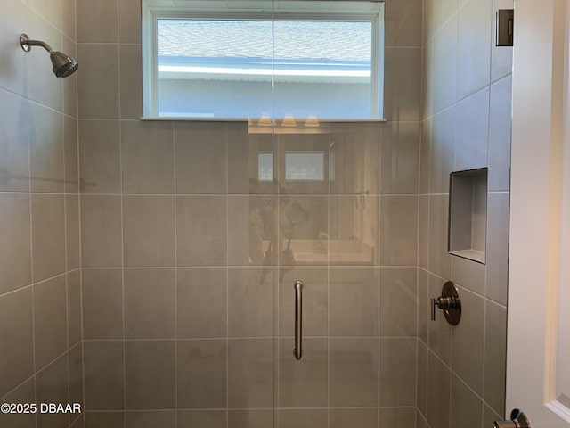 2009 Divot Dr, Daytona Beach, FL 32124 - bathroom featuring a wealth of natural light and a stall shower