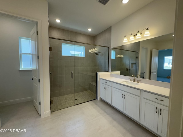 2009 Divot Dr, Daytona Beach, FL 32124 - bathroom featuring visible vents, recessed lighting, a stall shower, and vanity