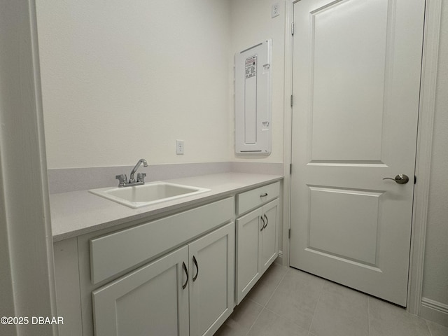 2009 Divot Dr, Daytona Beach, FL 32124 - bathroom featuring tile patterned floors, vanity, and electric panel