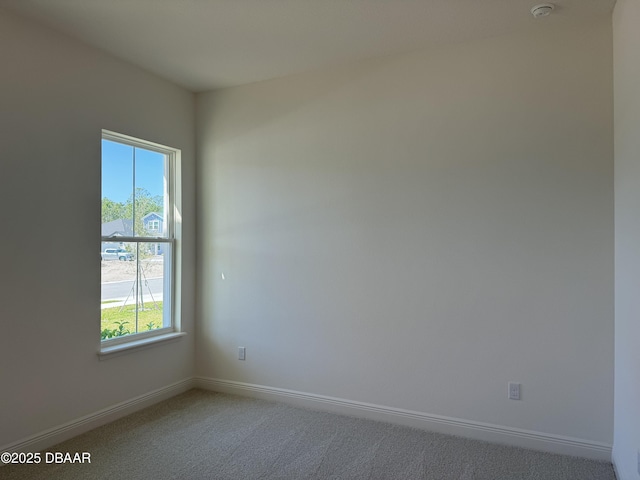 2009 Divot Dr, Daytona Beach, FL 32124 - unfurnished room featuring plenty of natural light, carpet, and baseboards
