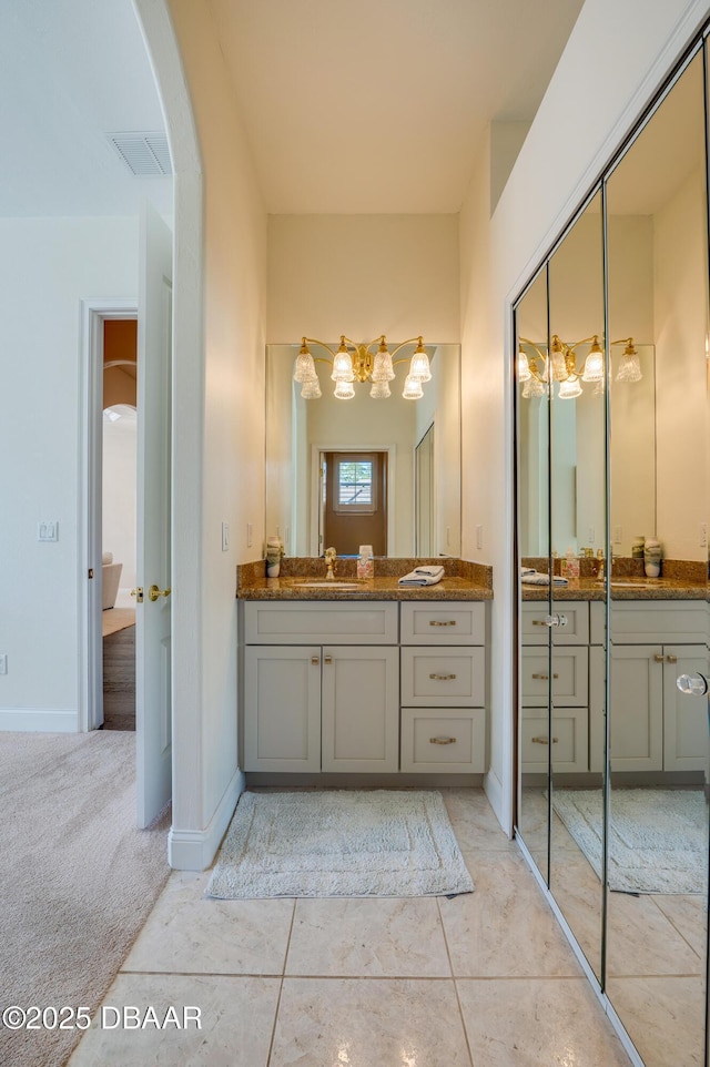 full bathroom featuring vanity, baseboards, visible vents, and tile patterned flooring