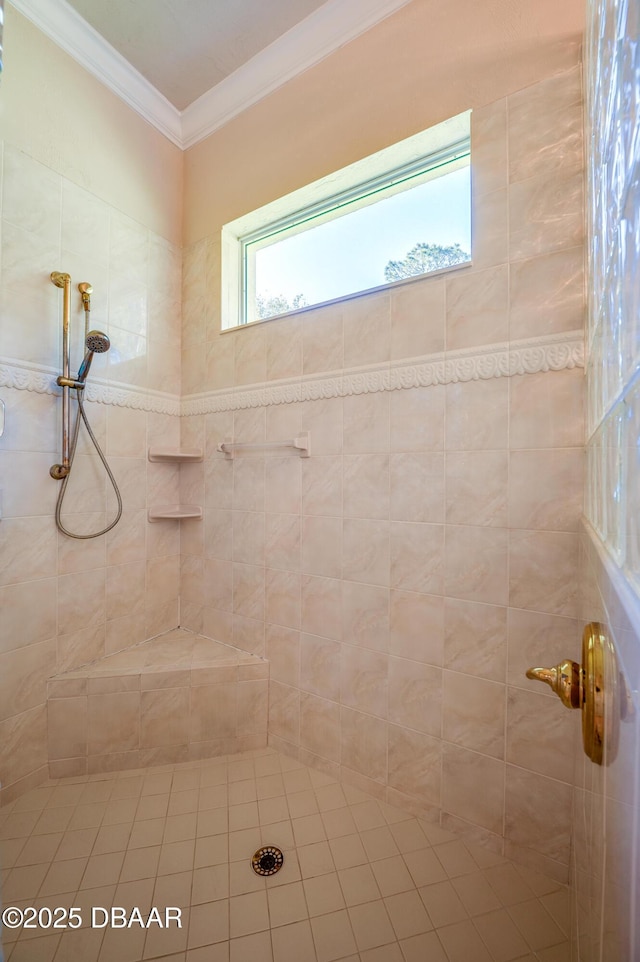 full bathroom with ornamental molding and a tile shower