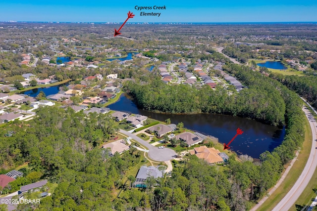 bird's eye view featuring a residential view and a water view