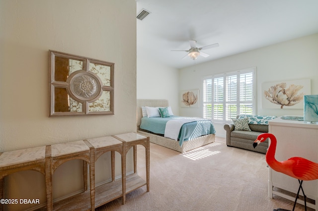 carpeted bedroom featuring visible vents and ceiling fan