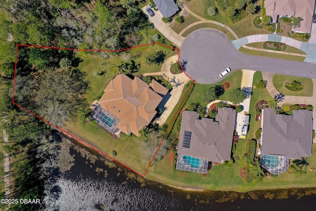 birds eye view of property featuring a water view