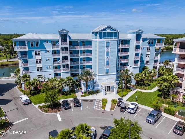 view of building exterior with a water view