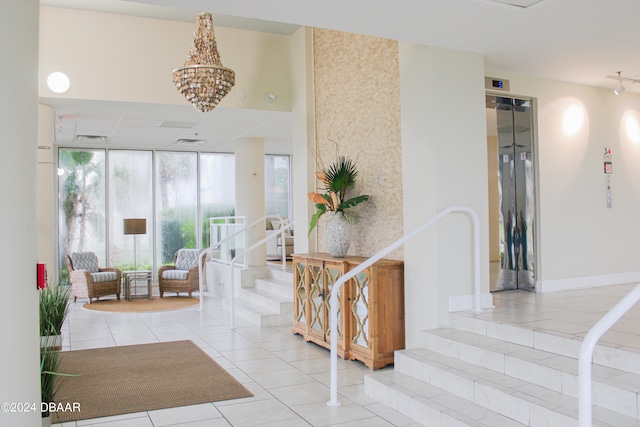 interior space with tile patterned floors and an inviting chandelier