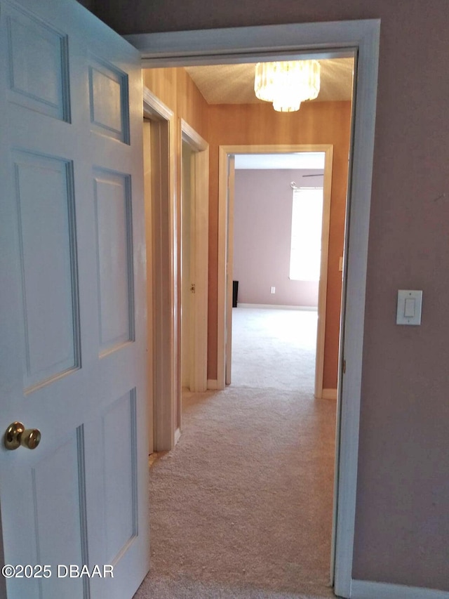 hallway featuring light carpet