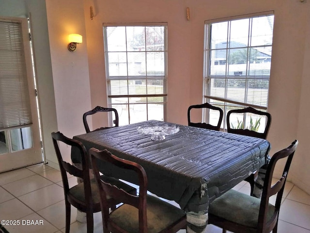 dining space with a healthy amount of sunlight and light tile patterned floors