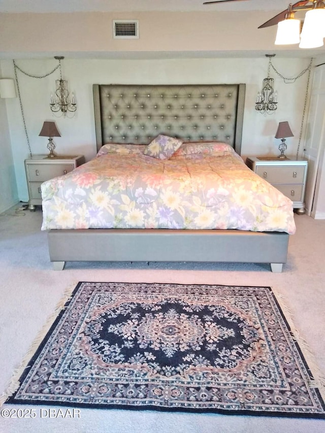 carpeted bedroom featuring ceiling fan