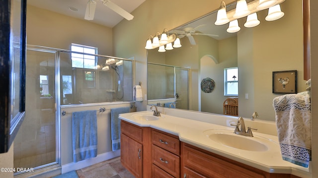 bathroom featuring vanity, an enclosed shower, and ceiling fan