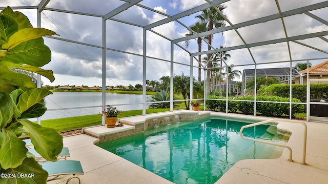 view of swimming pool with glass enclosure, a patio area, and a water view