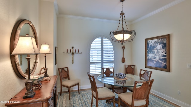 dining space with crown molding