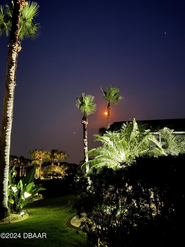 view of swimming pool with a lanai and a water view