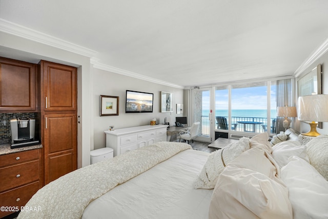 bedroom featuring crown molding, hardwood / wood-style floors, and access to outside